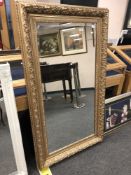 A 4' x 2' golden framed mirror