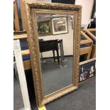 A 4' x 2' golden framed mirror