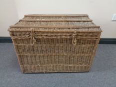 A wicker picnic hamper and luggage case