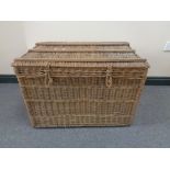 A wicker picnic hamper and luggage case