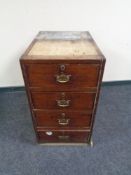 A 19th century four drawer pedestal with brass drop handles