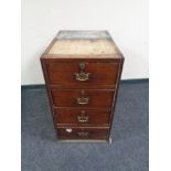 A 19th century four drawer pedestal with brass drop handles