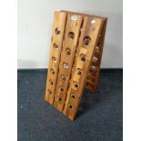 A folding teak Deuba 18 bottle wine rack