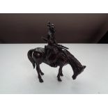 A bronze figure of a Japanese Samurai on horse back