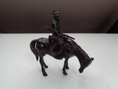 A bronze figure of a Japanese Samurai on horse back