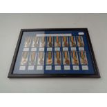 A set of sixteen framed Victory miniature medals in display frame