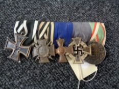 A group of five WW I medals on ribbons