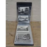 An album of antique black and white postcards depicting Blackpool and trolley busses