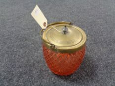 An early twentieth century pink glass and plated biscuit barrel