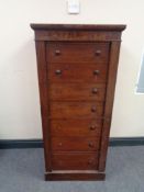 A Victorian mahogany Wellington chest fitted seven drawers with knob handles (five missing)