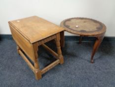 A small oak drop leaf occasional table and an Indian occasional table