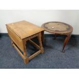 A small oak drop leaf occasional table and an Indian occasional table