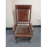 An Edwardian mahogany American style rocking chair