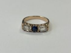 A three stone diamond and sapphire ring, approx.