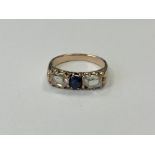 A three stone diamond and sapphire ring, approx.