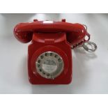 A red cased vintage telephone