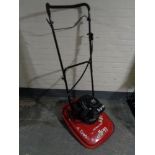 An Allen 446 hover trim petrol mower