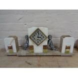 A three piece marble Art Deco clock garniture with pendulum and key