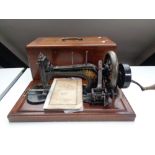 A twentieth century mahogany cased sewing machine