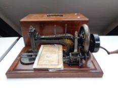 A twentieth century mahogany cased sewing machine