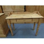 A pine console table fitted a drawer