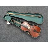 An early 20th century violin and bow in coffin case CONDITION REPORT: Back 13".