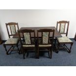 An oak effect refectory table and four chairs