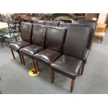 A set of six brown leather dining chairs and a pair of chairs