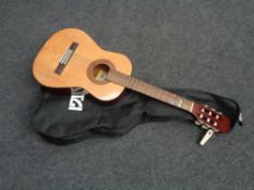 A Santos Martinez SM12 acoustic guitar in carry bag
