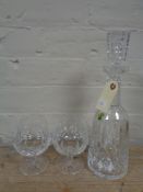 A Waterford Crystal decanter together with two brandy glasses