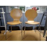 A pair of Ikea beech dining chairs