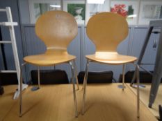 A pair of Ikea beech dining chairs