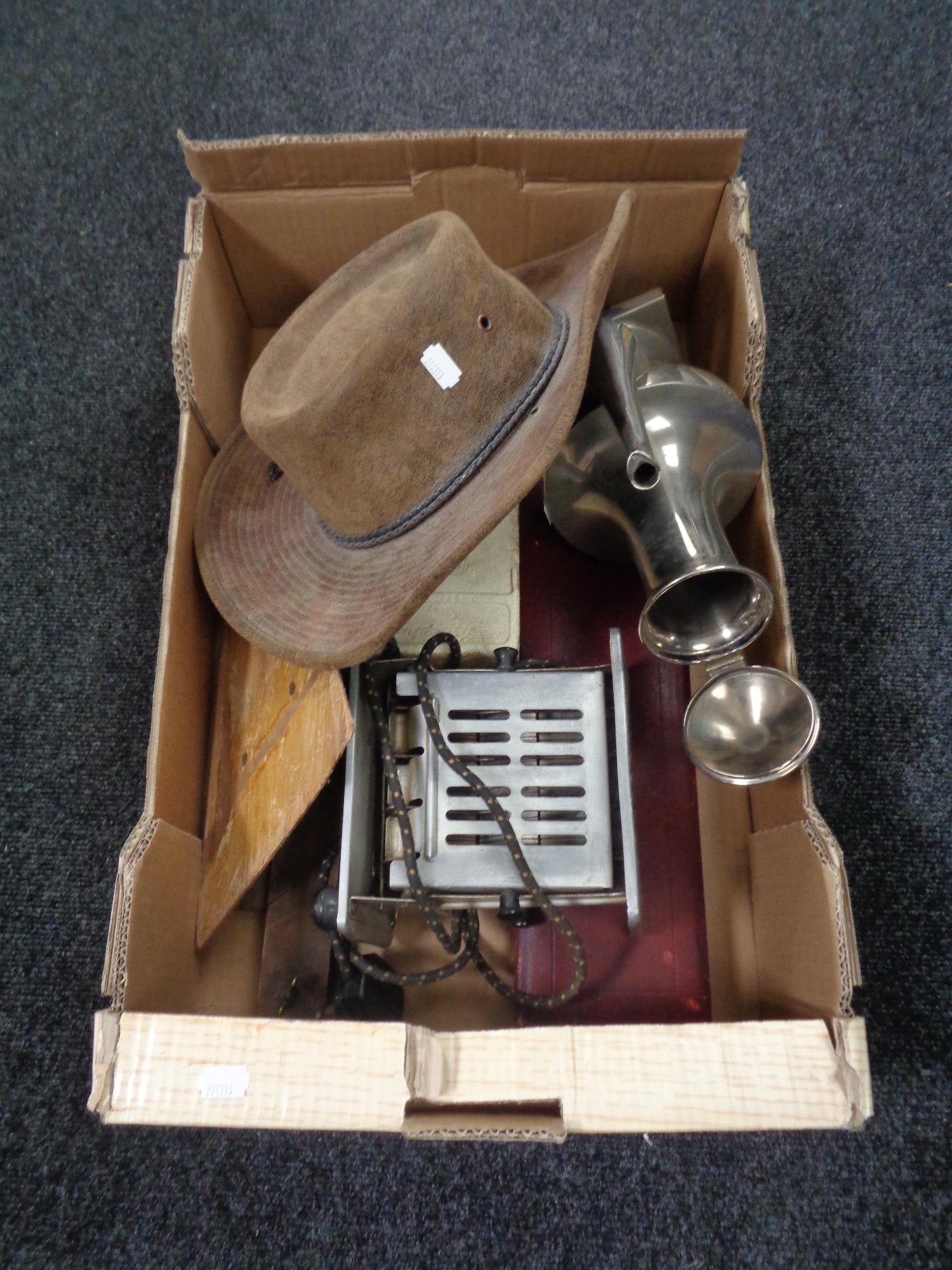 A box of vintage toaster, leather hat,