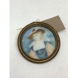 A hand painted portrait miniature depicting a lady wearing a hat, 6 cm x 6 cm.