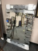 An all glass contemporary wave mirror,