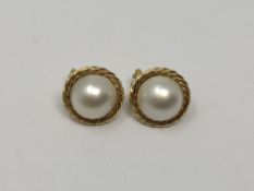 A pair of 18ct gold mabe pearl earrings.