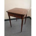 A Victorian mahogany envelope card table with gilt metal mounts