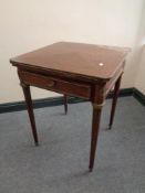 A Victorian mahogany envelope card table with gilt metal mounts