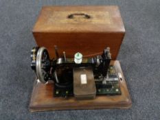 A mahogany cased vintage German sewing machine by Frister and Rossmann