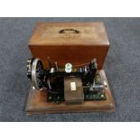 A mahogany cased vintage German sewing machine by Frister and Rossmann