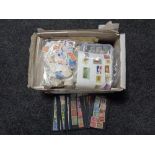 A box of loose 20th century stamps of the world