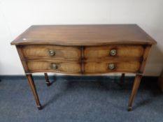A Regency style four drawer chest on raised legs