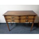 A Regency style four drawer chest on raised legs