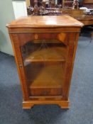 An inlaid yew wood audio cabinet