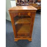 An inlaid yew wood audio cabinet