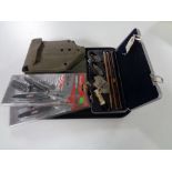 A tray of cased gun cleaning kit, two Berkley fishing tools (new),