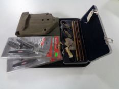 A tray of cased gun cleaning kit, two Berkley fishing tools (new),