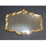 A gilt framed overmantel mirror