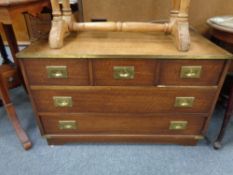 A campaign style leather topped chest fitted with five drawers