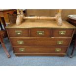 A campaign style leather topped chest fitted with five drawers